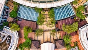 Aerial view of a modern building surrounded by greenery in Banten, Indonesia.